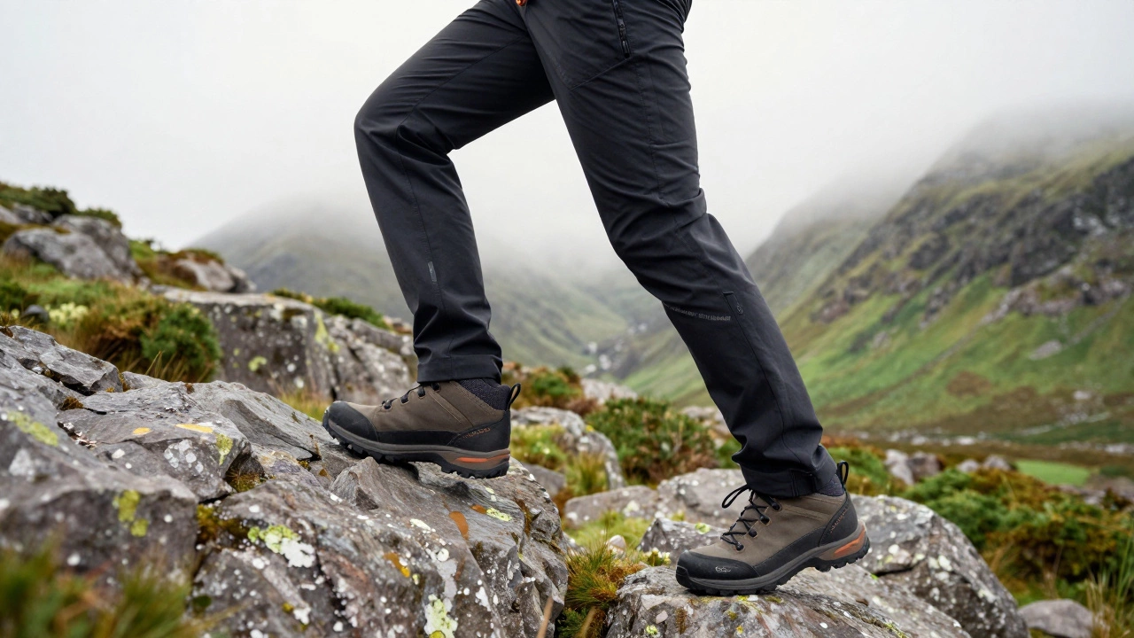 Hiker in articulated performance trousers navigating rocky terrain in Wicklow Mountains