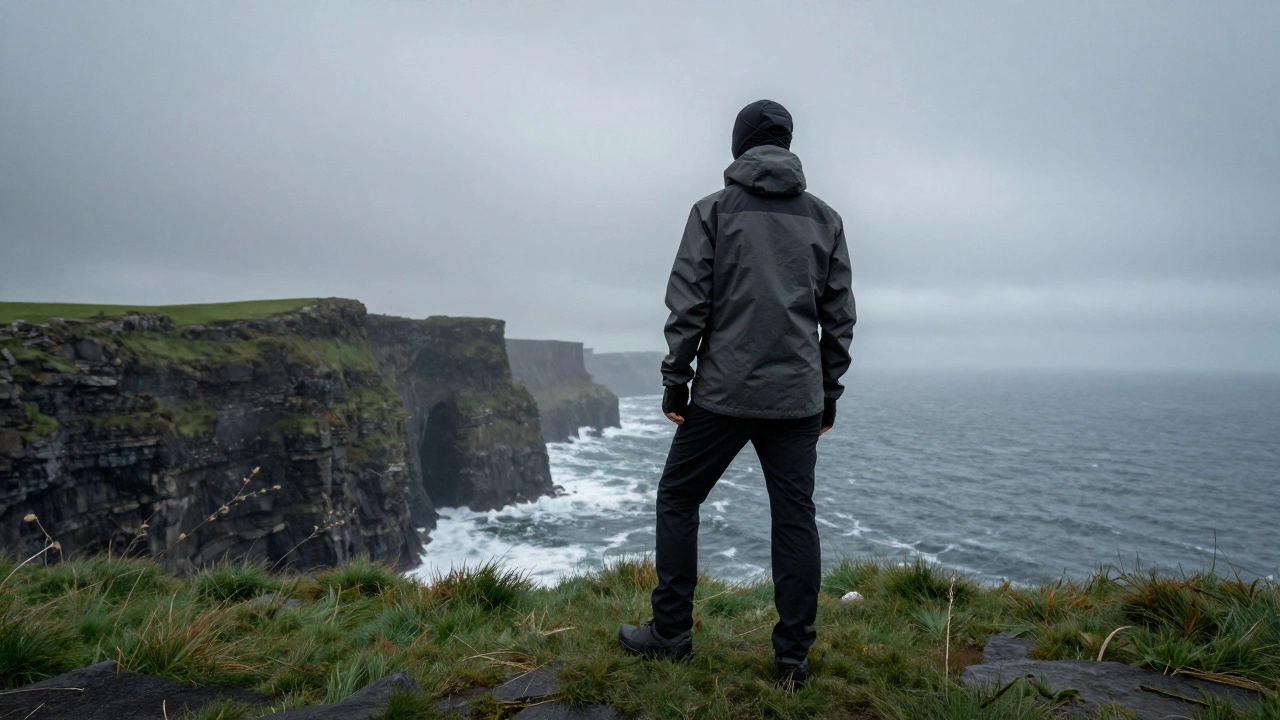 Person in sportswear hiking on a misty Irish coastal path